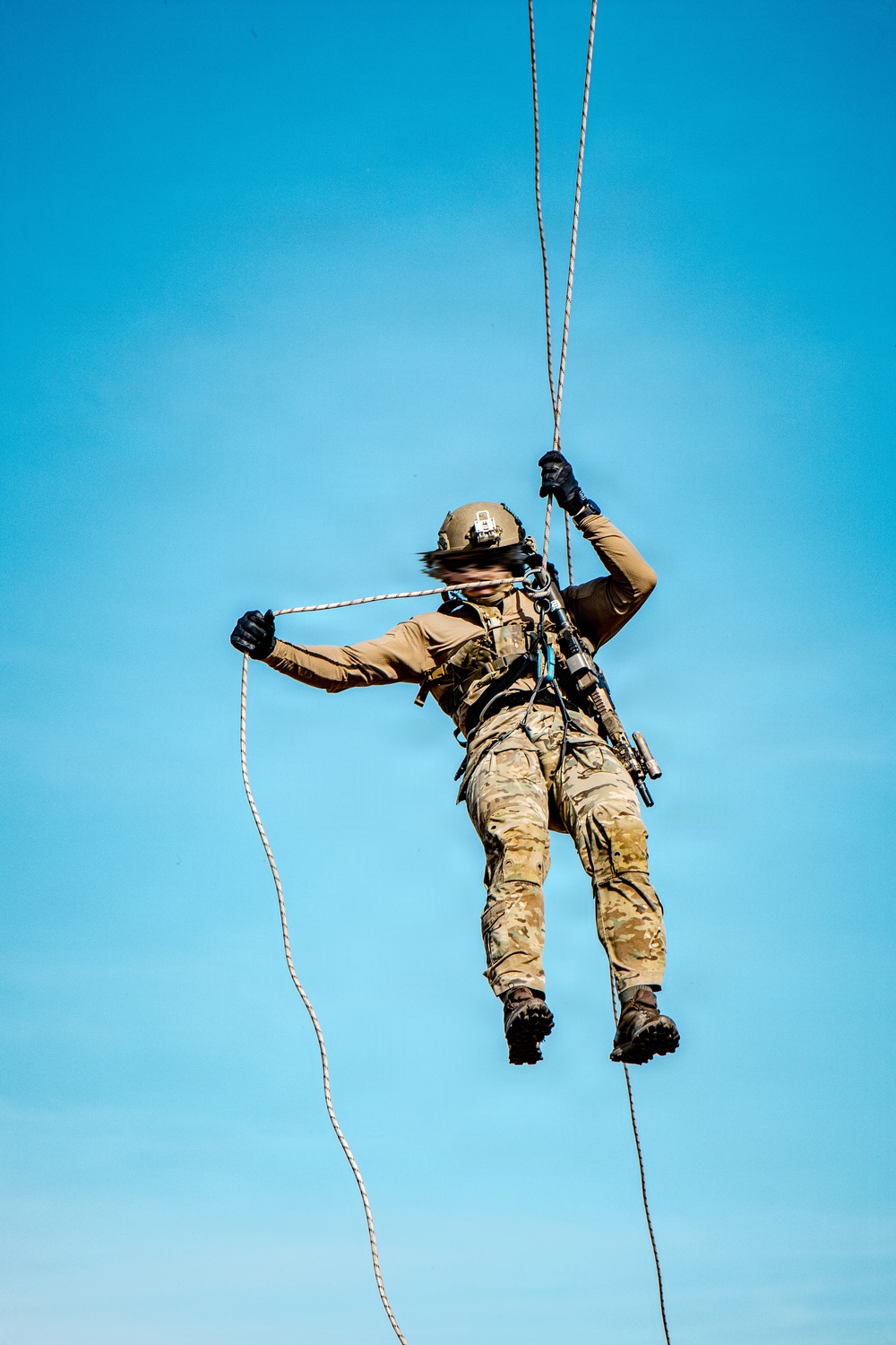 7th SFG (A) soldier rappels from a UH-60