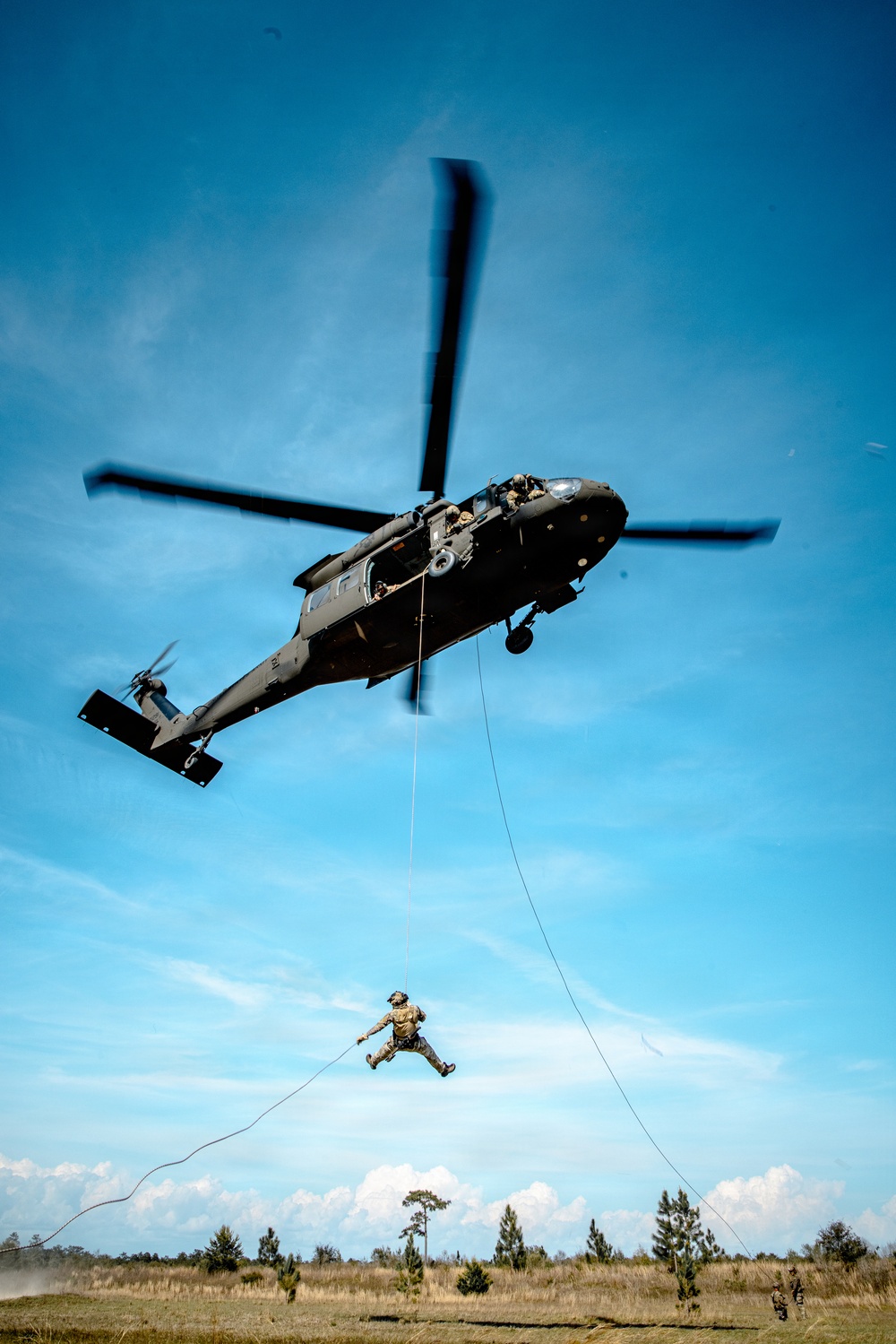 7th SFG (A) soldier rappels from a UH-60