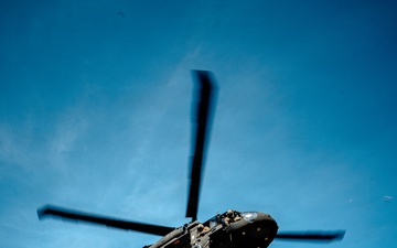 7th SFG (A) soldier rappels from a UH-60