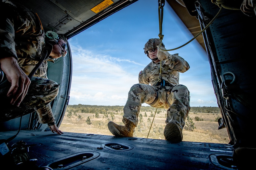 6th RTB soldier prepares to rappel, from a UH-60