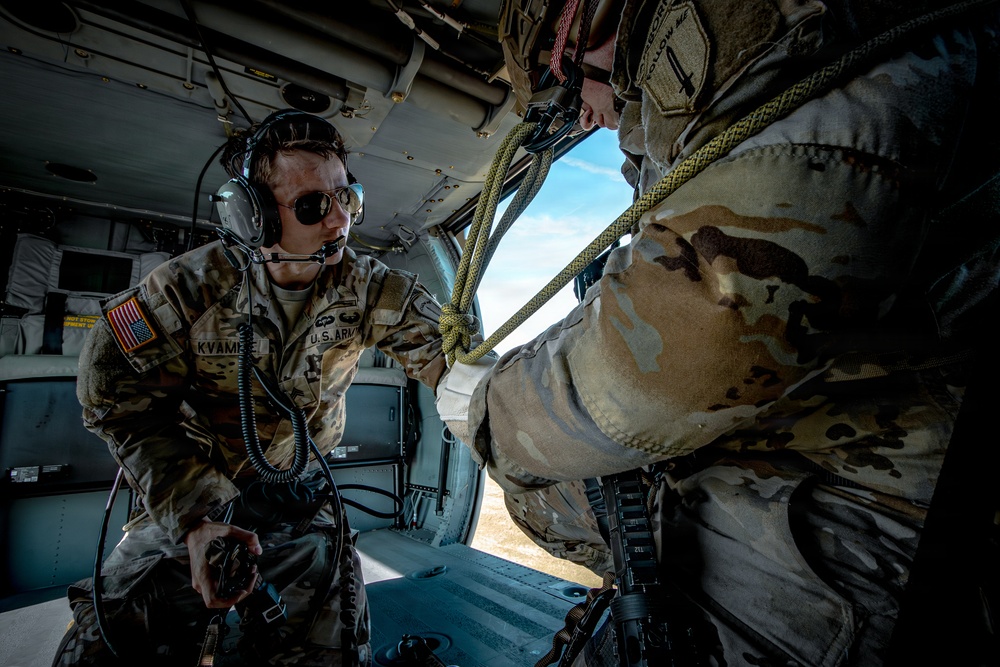 Soldier preparing to rappel, from a UH-60