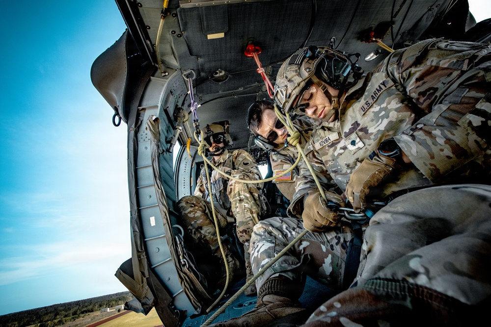 Soldier preparing to rappel, from a UH-60