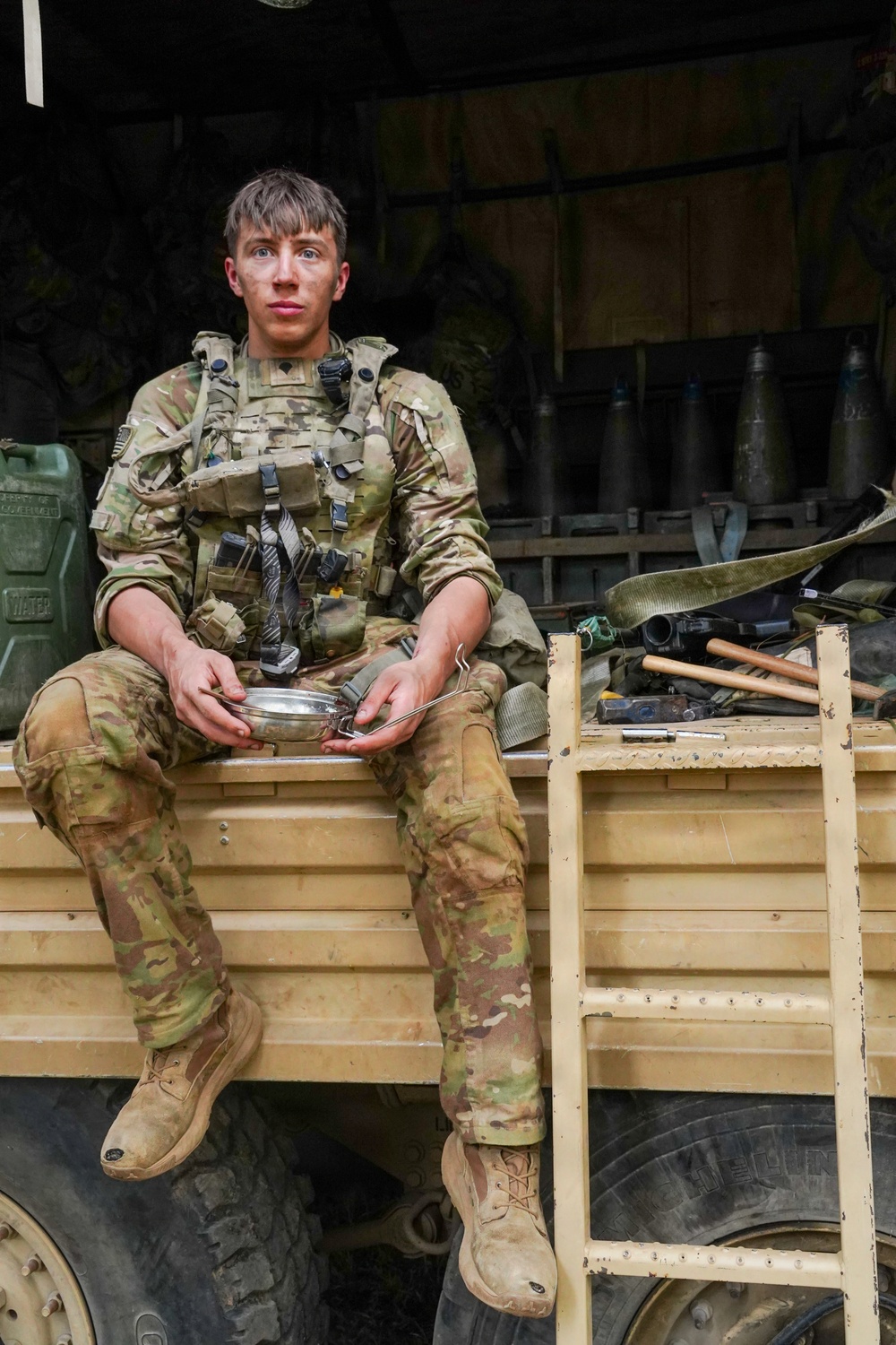 101st Soldier takes a meal break on gun line fighting position at JRTC