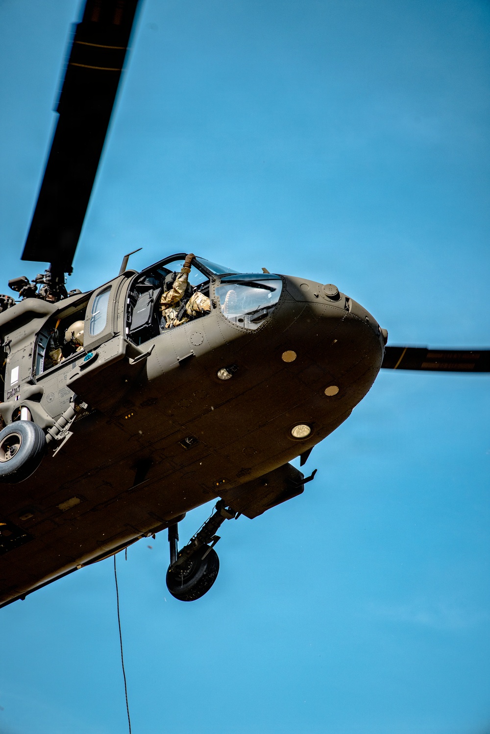 UH-60 hovers as soldiers from 7th SFG (A) and 6th RTB rappel