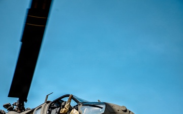 UH-60 hovers as soldiers from 7th SFG (A) and 6th RTB rappel