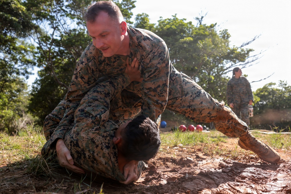 U.S. Marines conduct 12-kilometer hike and Marine Corps Martial Arts Program training during Communication Strategy and Operations Field Training Exercise