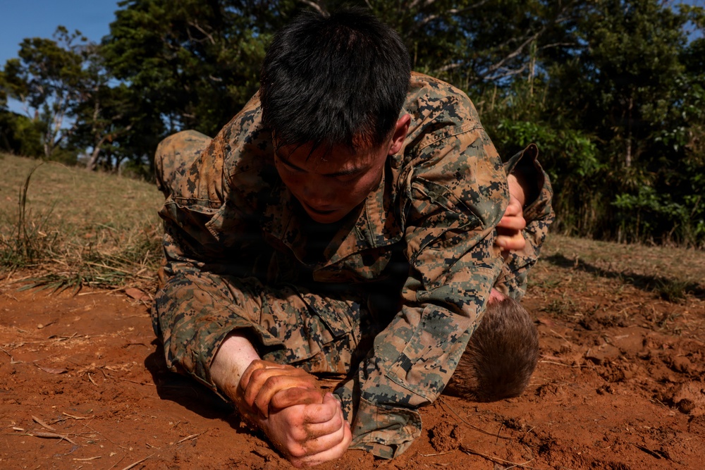 U.S. Marines conduct 12-kilometer hike and Marine Corps Martial Arts Program training during Communication Strategy and Operations Field Training Exercise