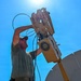 U.S. Air Force 644th Combat Communication Squadron Airmen installs a satellite communication dish