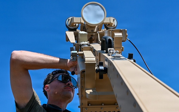U.S. Air Force 644th Combat Communication Squadron Airmen installs a satellite communication dish