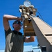 U.S. Air Force 644th Combat Communication Squadron Airmen installs a satellite communication dish