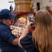 A U.S. Coast Guard Cutter Polar Star (WAGB 10) crew member poses for a family photo at Coast Guard Base Seattle after being reunited with family following a 146-day Antarctic deployment in support of Operation Deep Freeze, April 13, 2026.