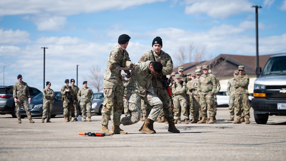 The 5th Security Forces Squadron exchanges job knowledge with the Army’s 816th Military Police Company during joint training