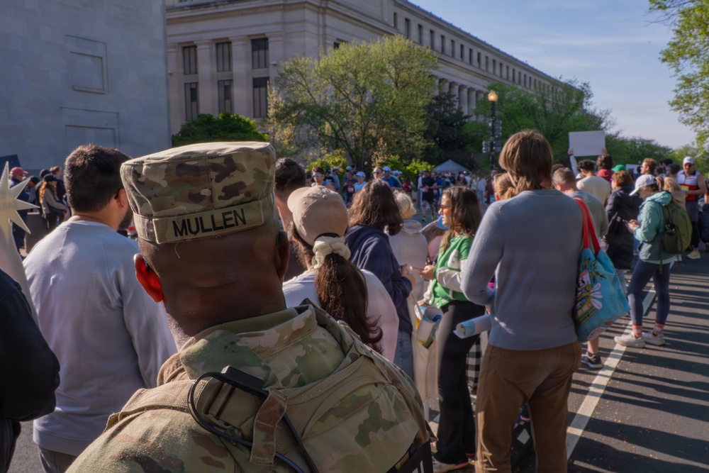 Mississippi National Guard Soldiers patrol at the Credit Union Cherry Blossom Ten Mile Run