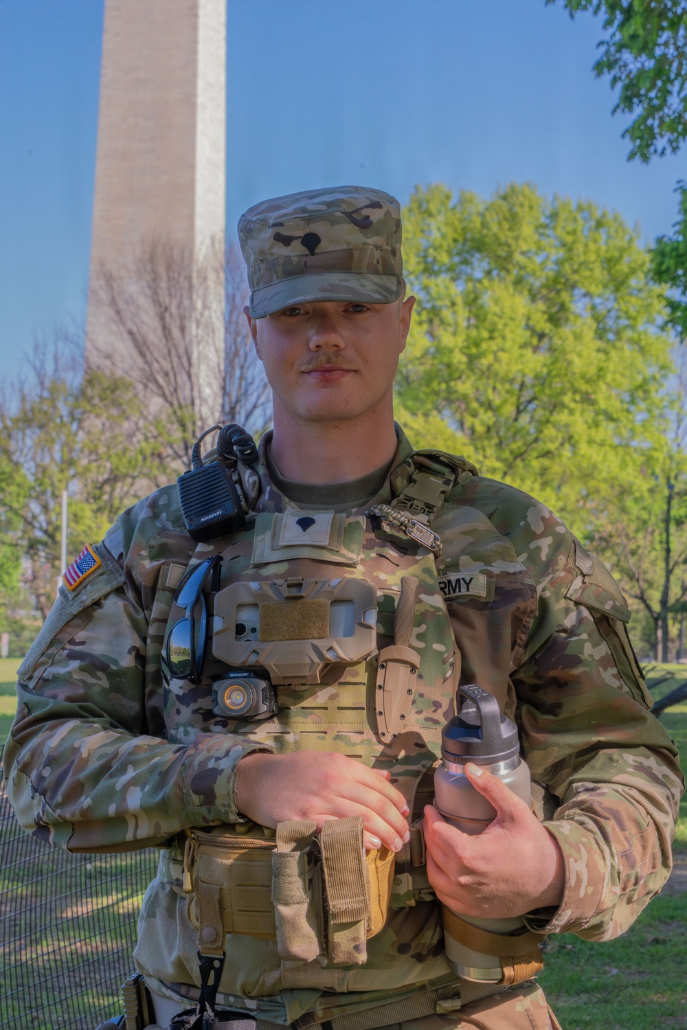 A Mississippi National Guard Soldier helps a member of the public at the Credit Union Cherry Blossom Ten Mile Run