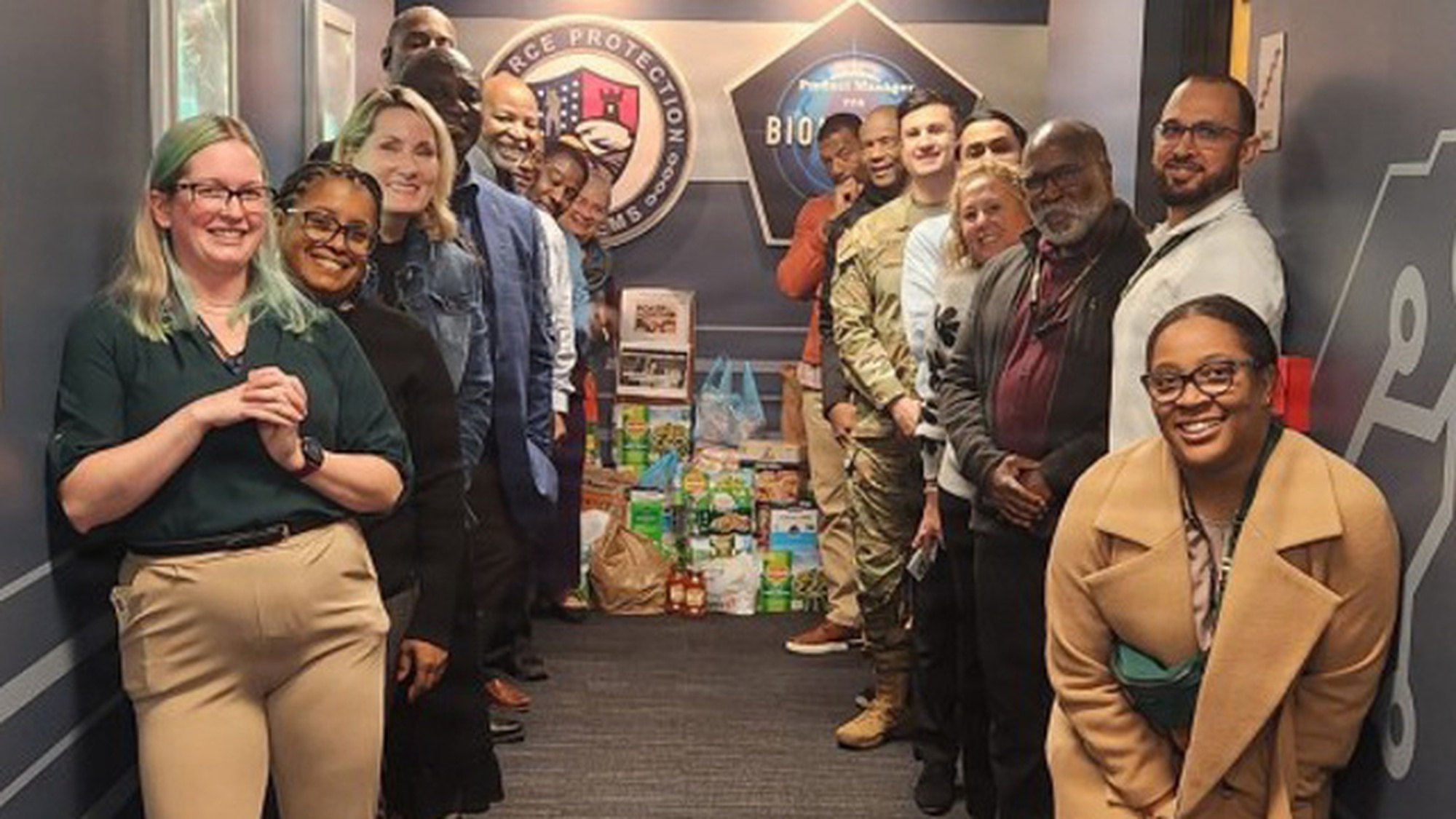 Employees from Product Manager Force Protection Systems (PM FPS) and Product Manager Biometrics (PM Biometrics) collected nearly 1,000 food items by organizing a food drive. (Photo Credit: Bill Bezek)