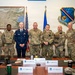 Col. Justin Secrest, 377th Air Base Wing and installation commander poses for a group photo with Kirtland Air Force Base Defenders