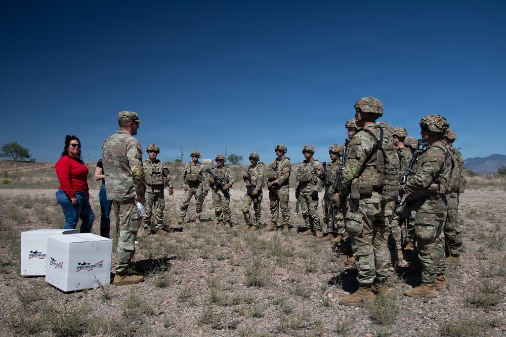 President and Director of Military and First Responders Programs Give Care Packages to JTF-SB Soldiers