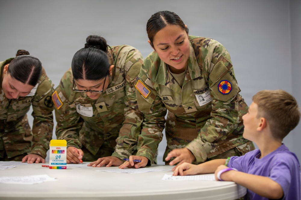 13th ACSC Soldiers Support Purple Up Day at Lakewood Elementary School