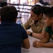 U.S. service members and Houston Texans engage with students at Law Elementary School