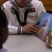 U.S. service members and Houston Texans engage with students at Law Elementary School