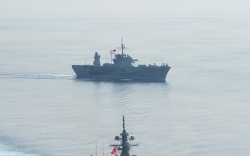 USS Blue Ridge (LCC 19) Steams Alongside Japan