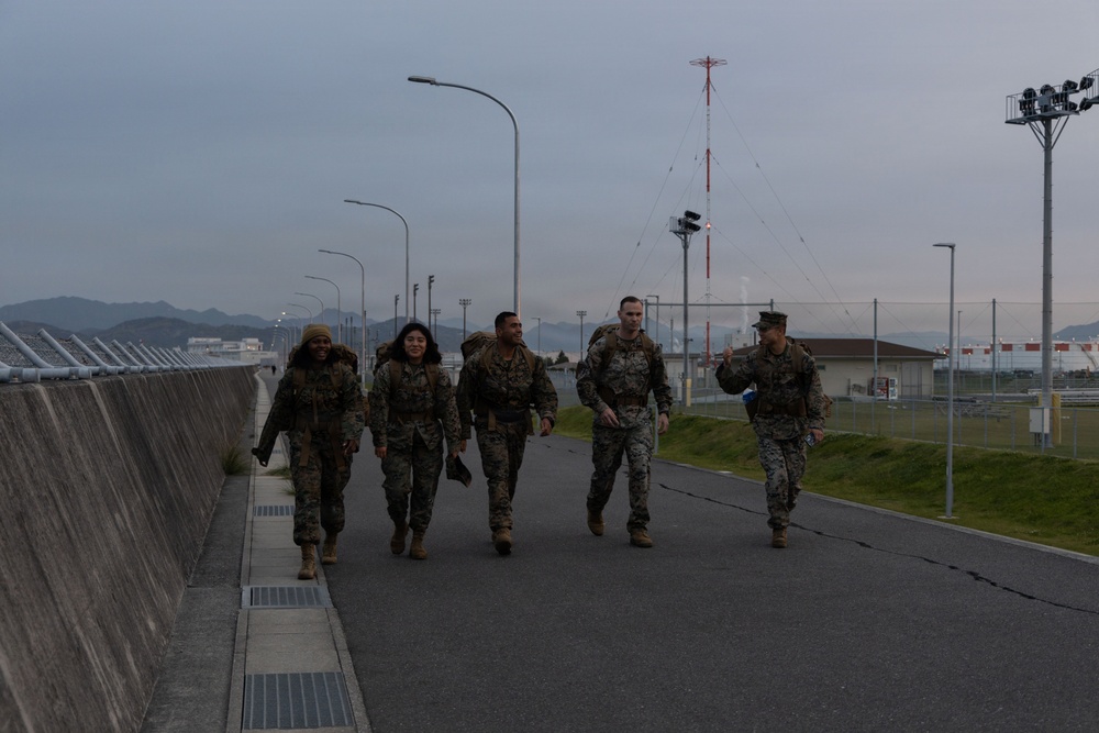MAG-12 Marines ruck during sunrise