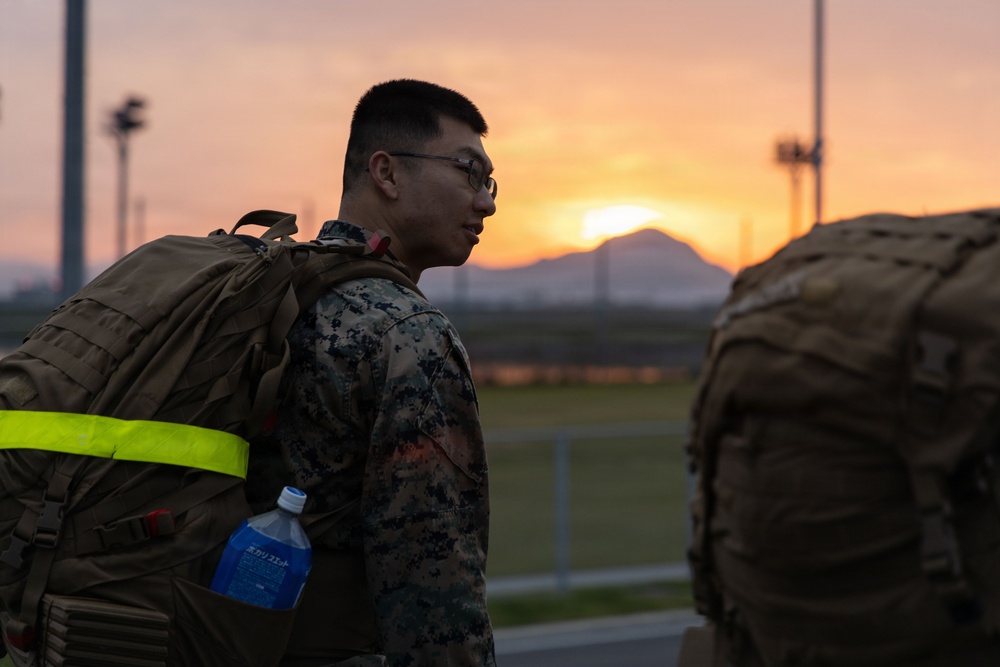 MAG-12 Marines ruck during sunrise