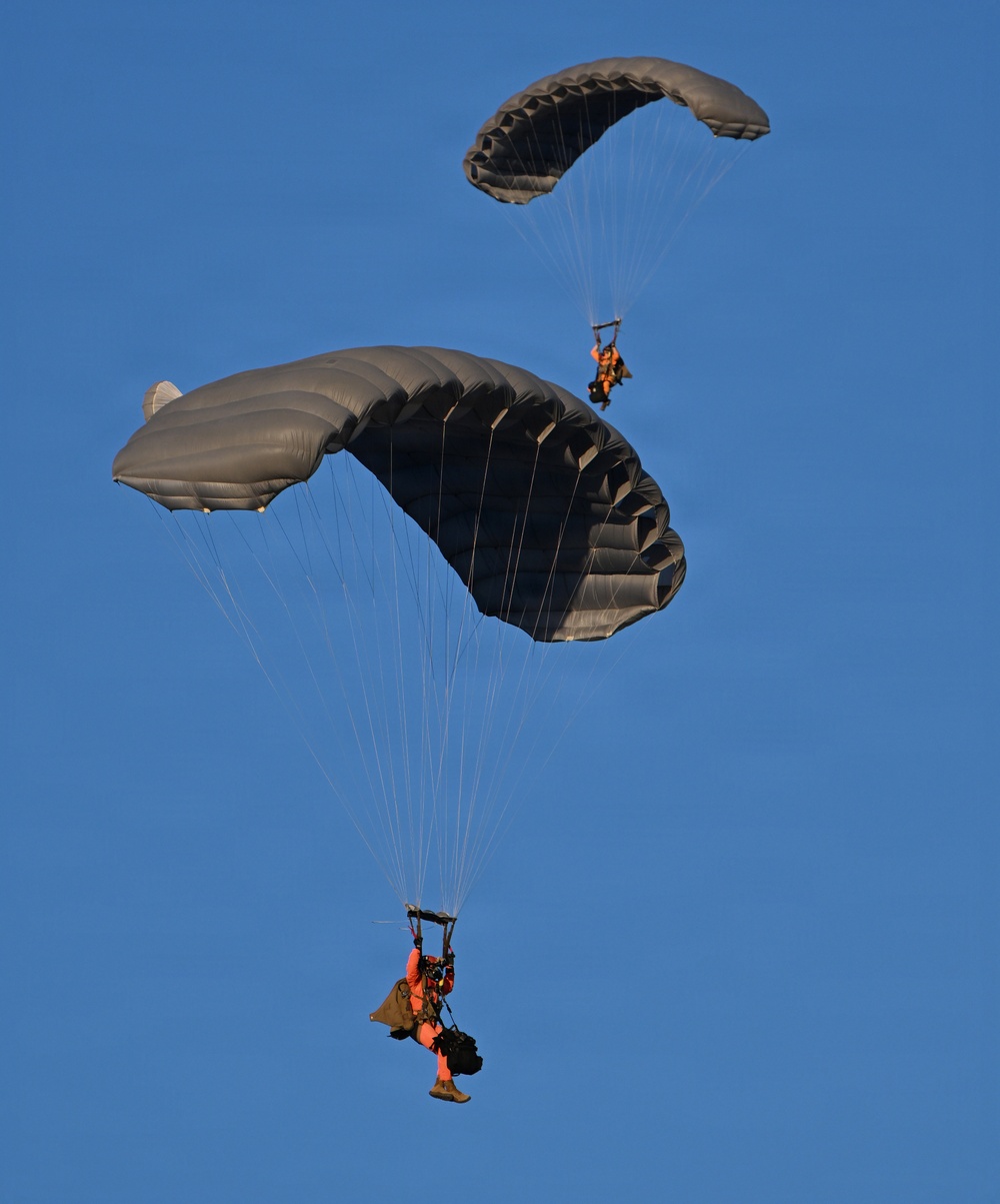 Military Freefall Students Jump Combat Equipment During Training