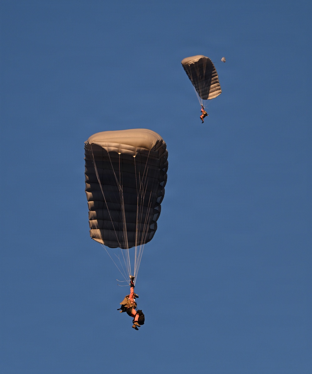 Military Freefall Students Jump Combat Equipment During Training