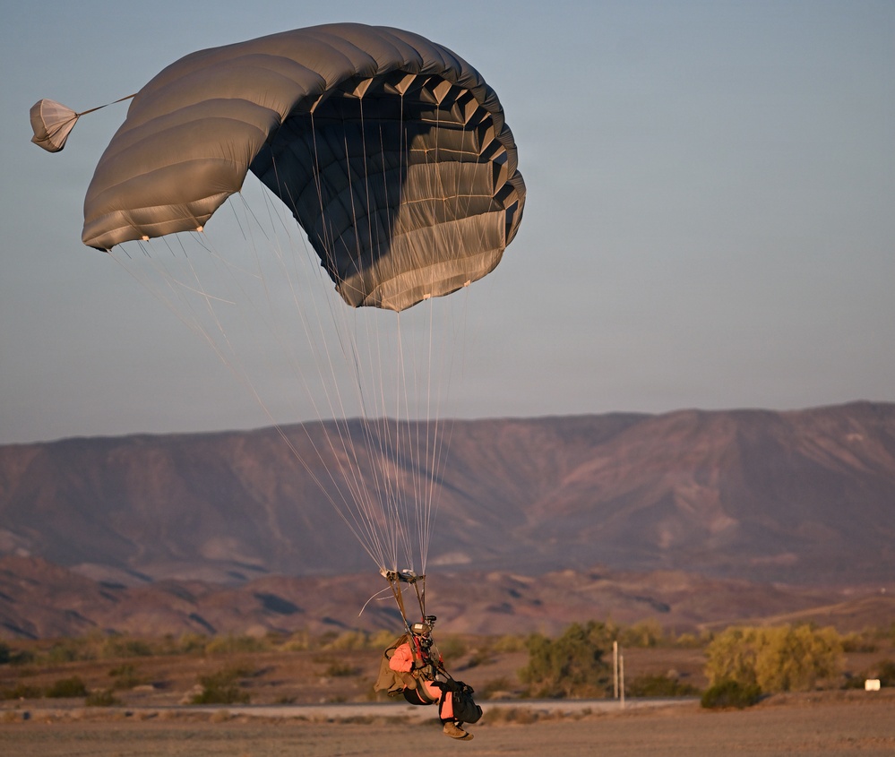 Military Freefall Students Jump Combat Equipment During Training