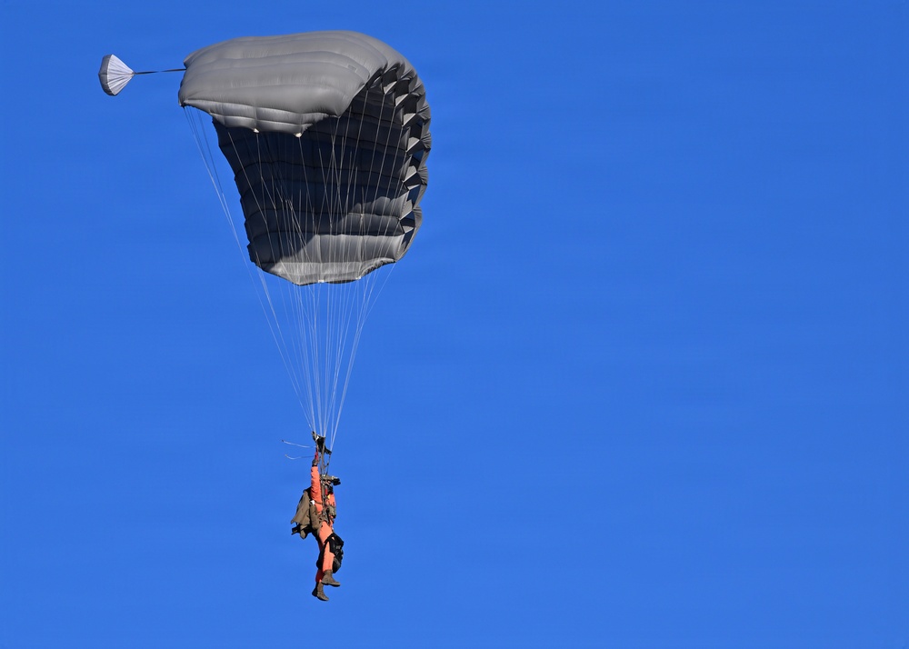 Military Freefall Students Jump Combat Equipment During Training