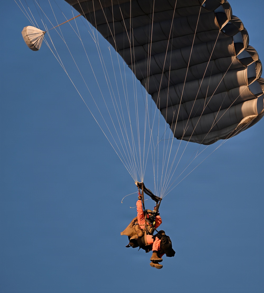 Military Freefall Students Jump Combat Equipment During Training