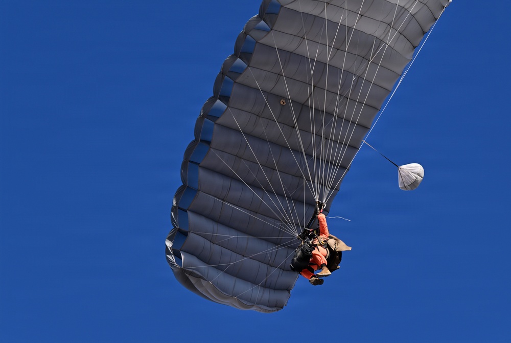 Military Freefall Students Jump Combat Equipment During Training