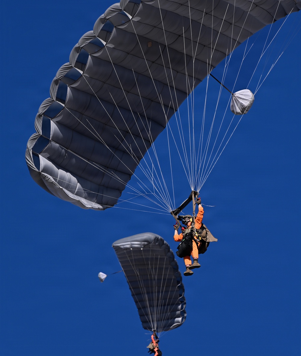 Military Freefall Students Jump Combat Equipment During Training