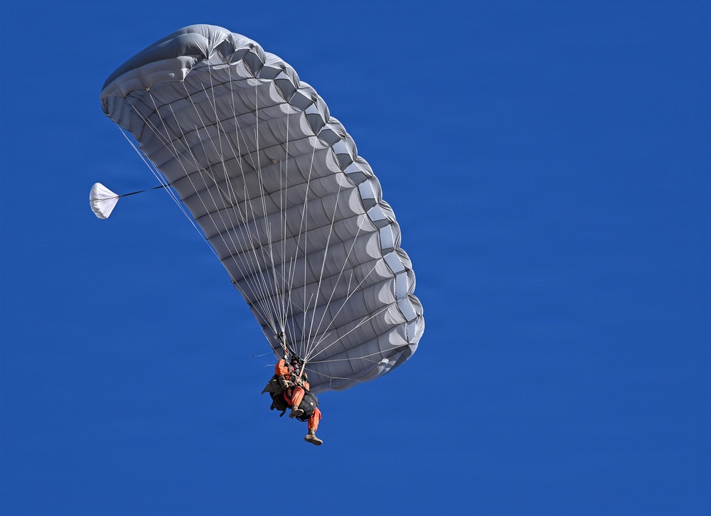 Military Freefall Students Jump Combat Equipment During Training