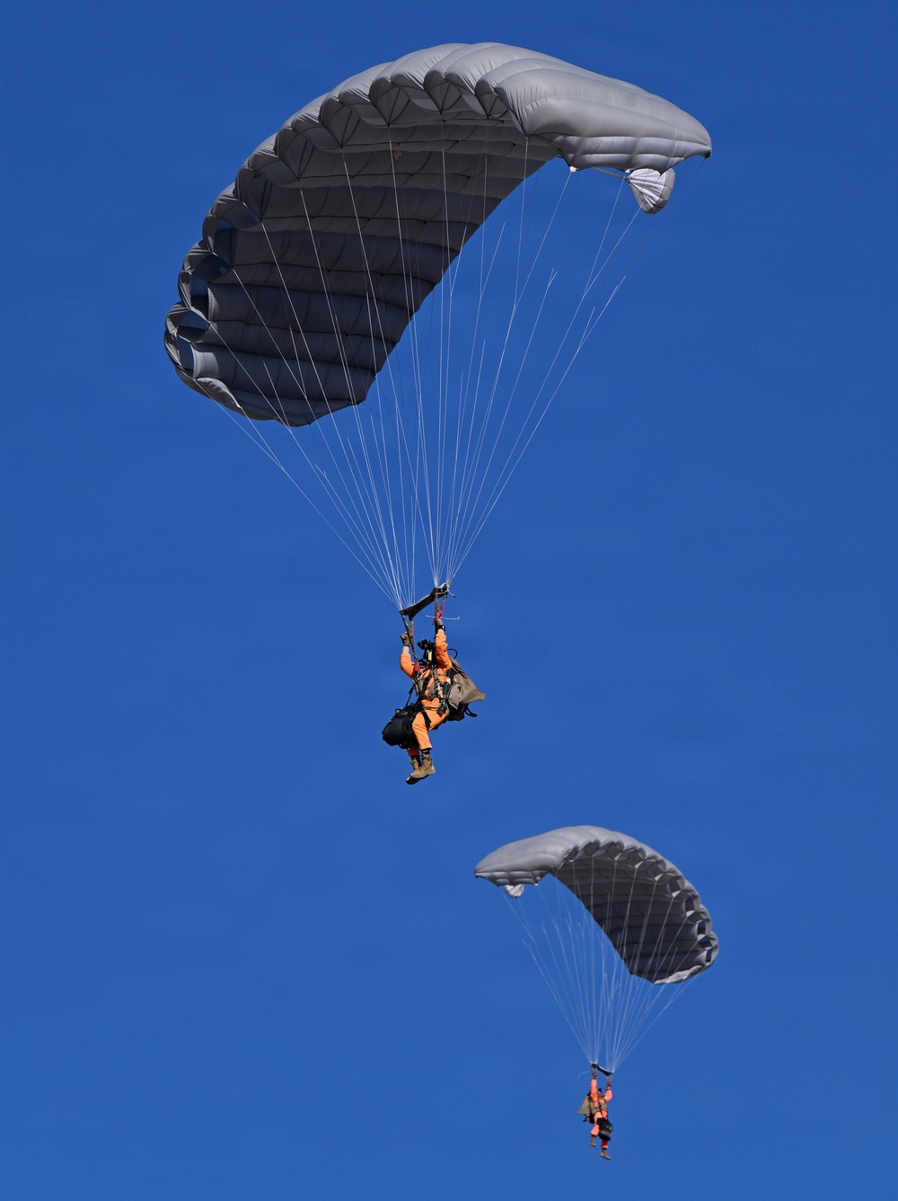 Military Freefall Students Jump Combat Equipment During Training
