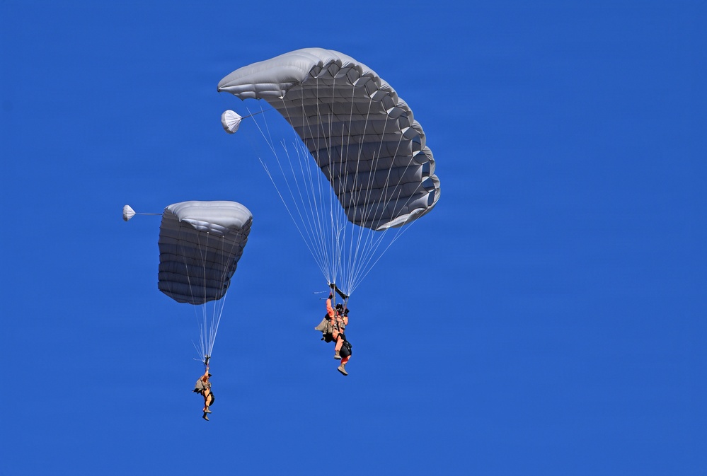 Military Freefall Students Jump Combat Equipment During Training