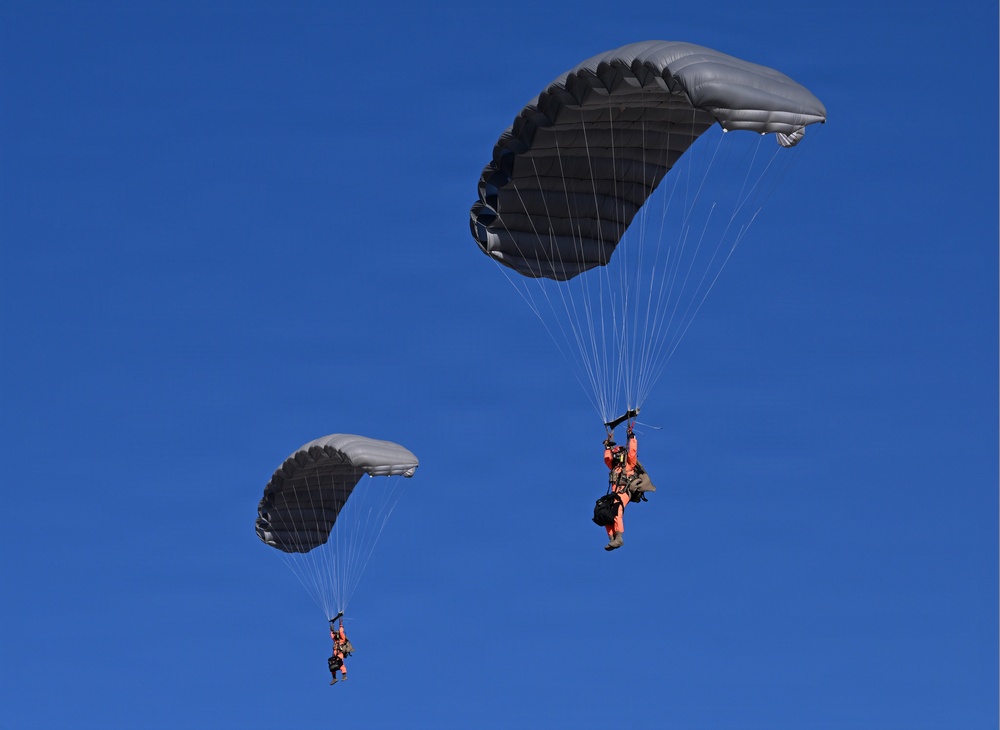 Military Freefall Students Jump Combat Equipment During Training