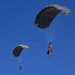 Military Freefall Students Jump Combat Equipment During Training
