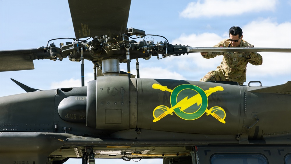 JTF-SB Army Soldiers execute UH-60 Black Hawk pre-flight checks