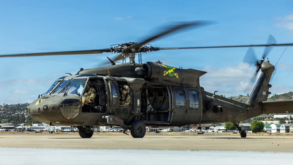 JTF-SB Army Soldiers execute UH-60 Black Hawk pre-flight checks