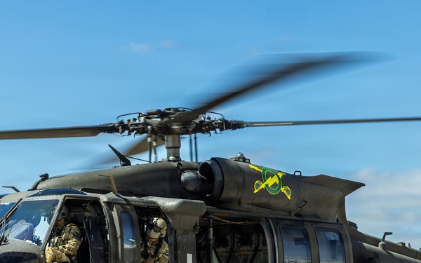 JTF-SB Army Soldiers execute UH-60 Black Hawk pre-flight checks