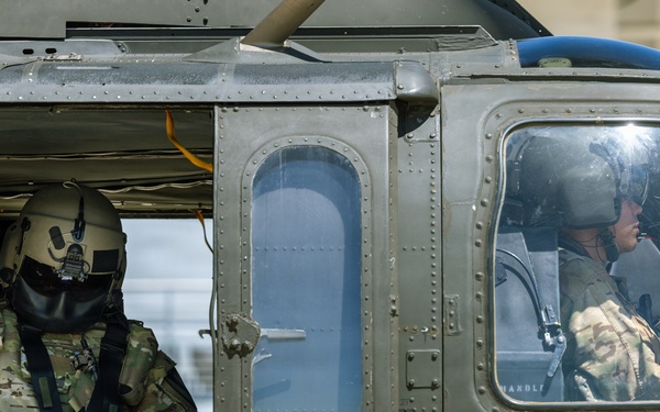 JTF-SB Army Soldiers execute UH-60 Black Hawk pre-flight checks