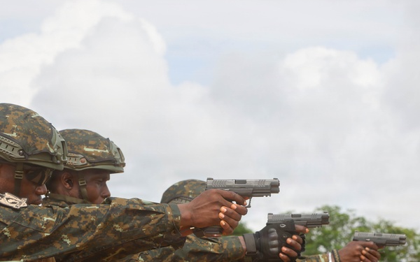 Multinational special operations forces execute rifle and pistol marksmanship drills during Flintlock 26