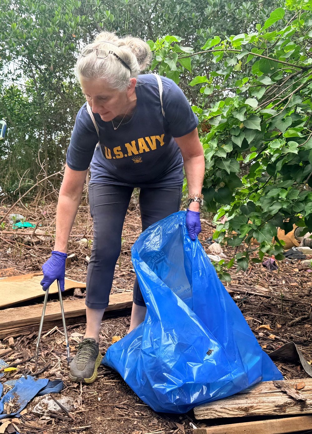 Laulima Navy volunteers unite to clean the Pearl Harbor Bike Path in Aiea.