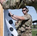 Airmen from the 113th Contingency Response Squadron fire M18 Sig Sauer handguns and transition with M4A1 carbine rifles at Camp Atterbury