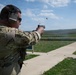 Airmen from the 113th Contingency Response Squadron fire M18 Sig Sauer handguns and transition with M4A1 carbine rifles at Camp Atterbury