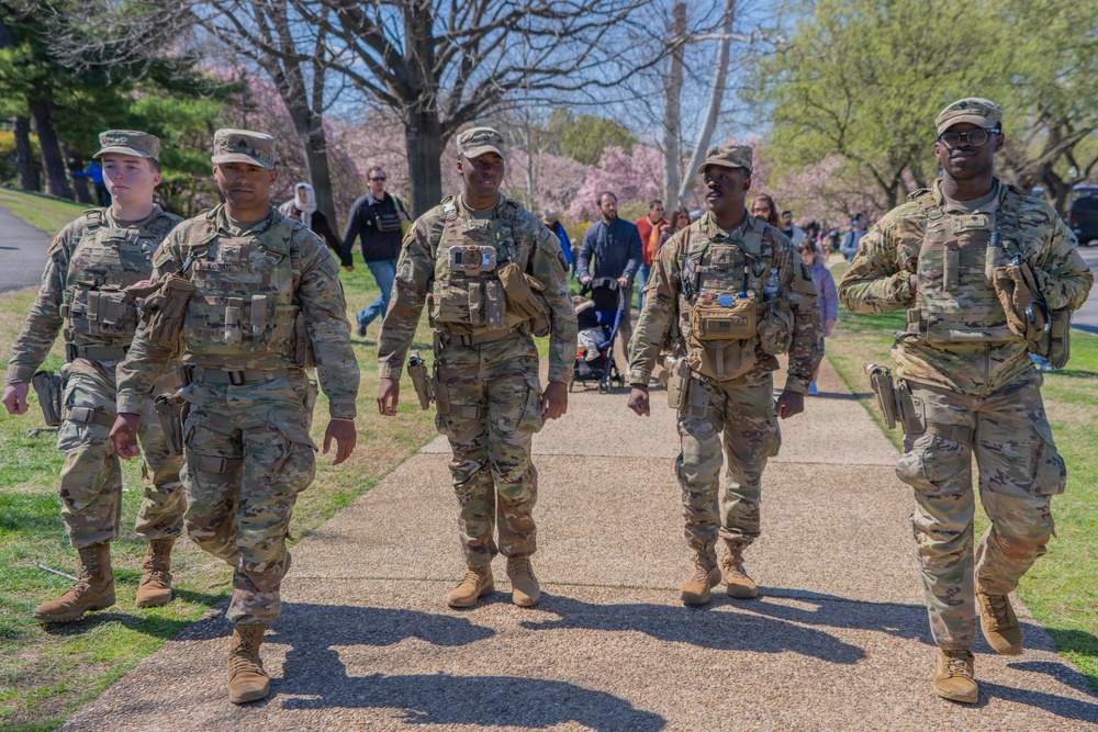 Soldiers from the Mississippi National Guard patrol during the Cherry Blossom Festival