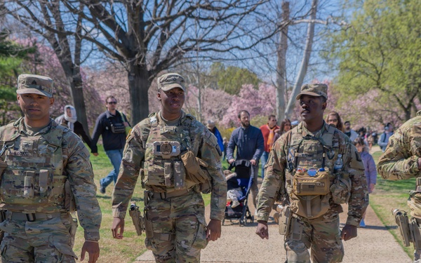 Soldiers from the Mississippi National Guard patrol during the Cherry Blossom Festival