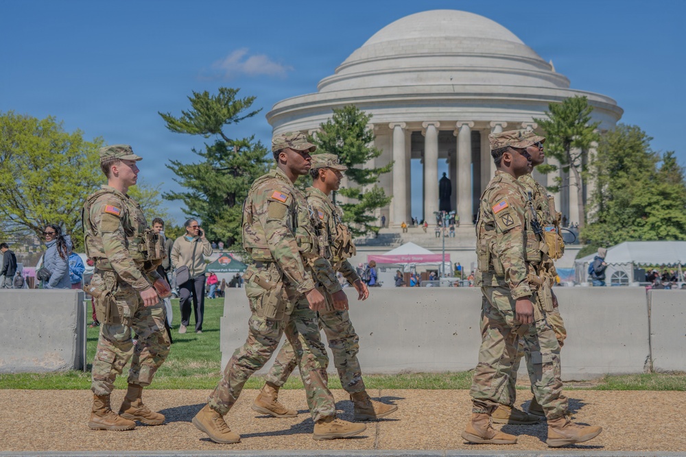 Soldiers from the Mississippi National Guard patrol during the Cherry Blossom Festival